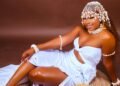 Marie-Dominique KACOU a woman in a white dress and white headdress