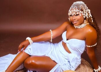 Marie-Dominique KACOU a woman in a white dress and white headdress