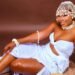 Marie-Dominique KACOU a woman in a white dress and white headdress
