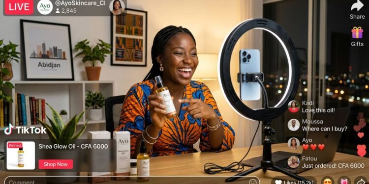 Young Ivorian entrepreneur doing a TikTok live shopping session on smartphone