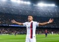 Kylian Mbappé in PSG white away jersey celebrating a hat-trick goal at Camp Nou stadi